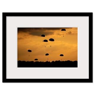 Army Soldiers parachute through the sky Framed Print