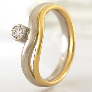 Ring in 750/  Gelbgold + 950/  Platin mit 1 Diamanten ca 0,08 ct
